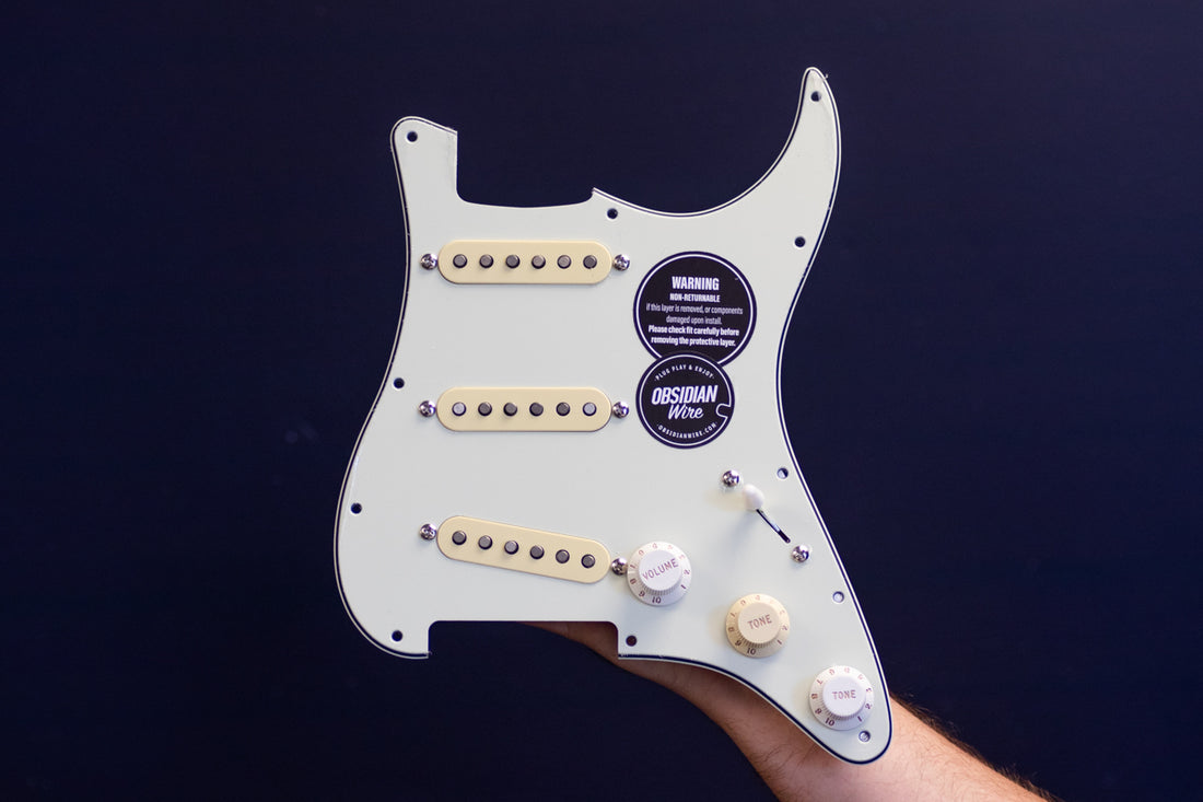 McCready Loaded Pickguard for Stratocaster using mint green pickguard and mixed aged white &amp; parchment knobs &amp; pickup covers.